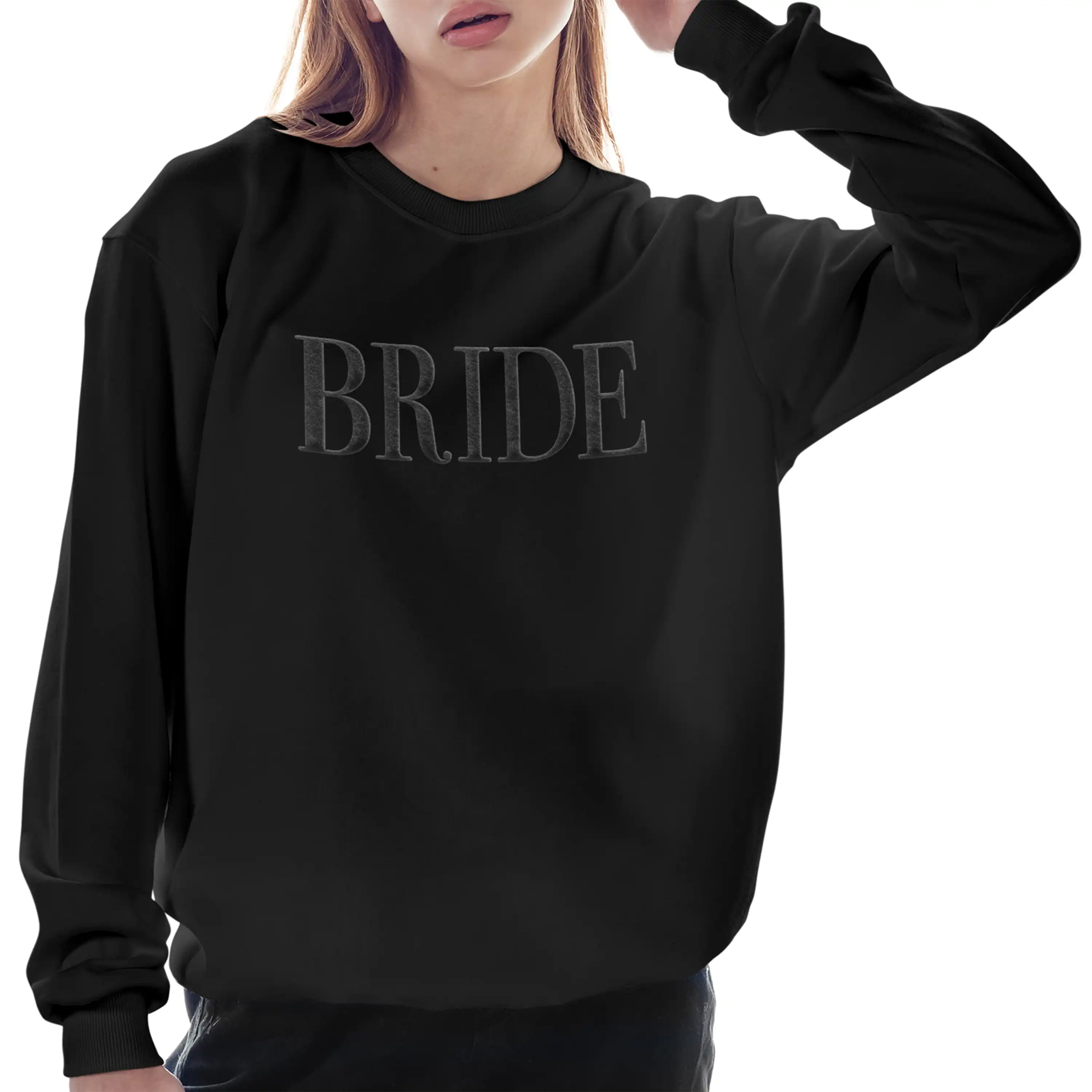 Black sweatshirt with 'BRIDE' text worn by a person on a white background