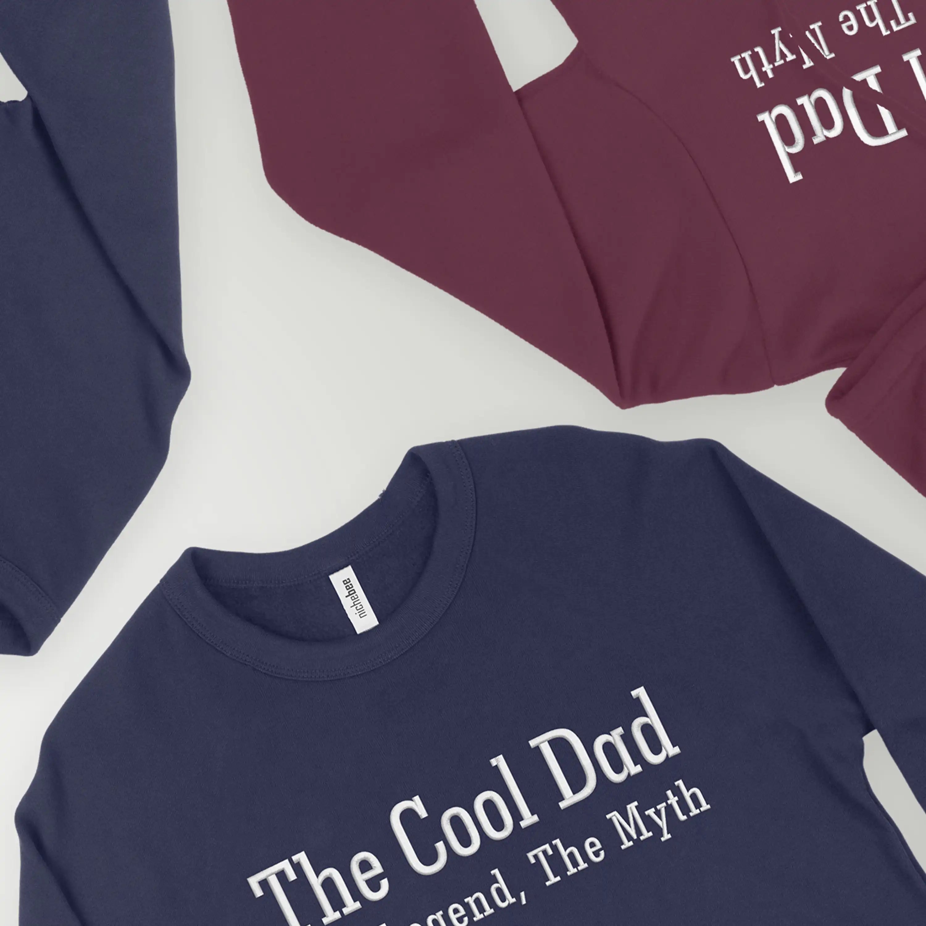Navy blue t-shirt with 'The Cool Dad' text on a white background
