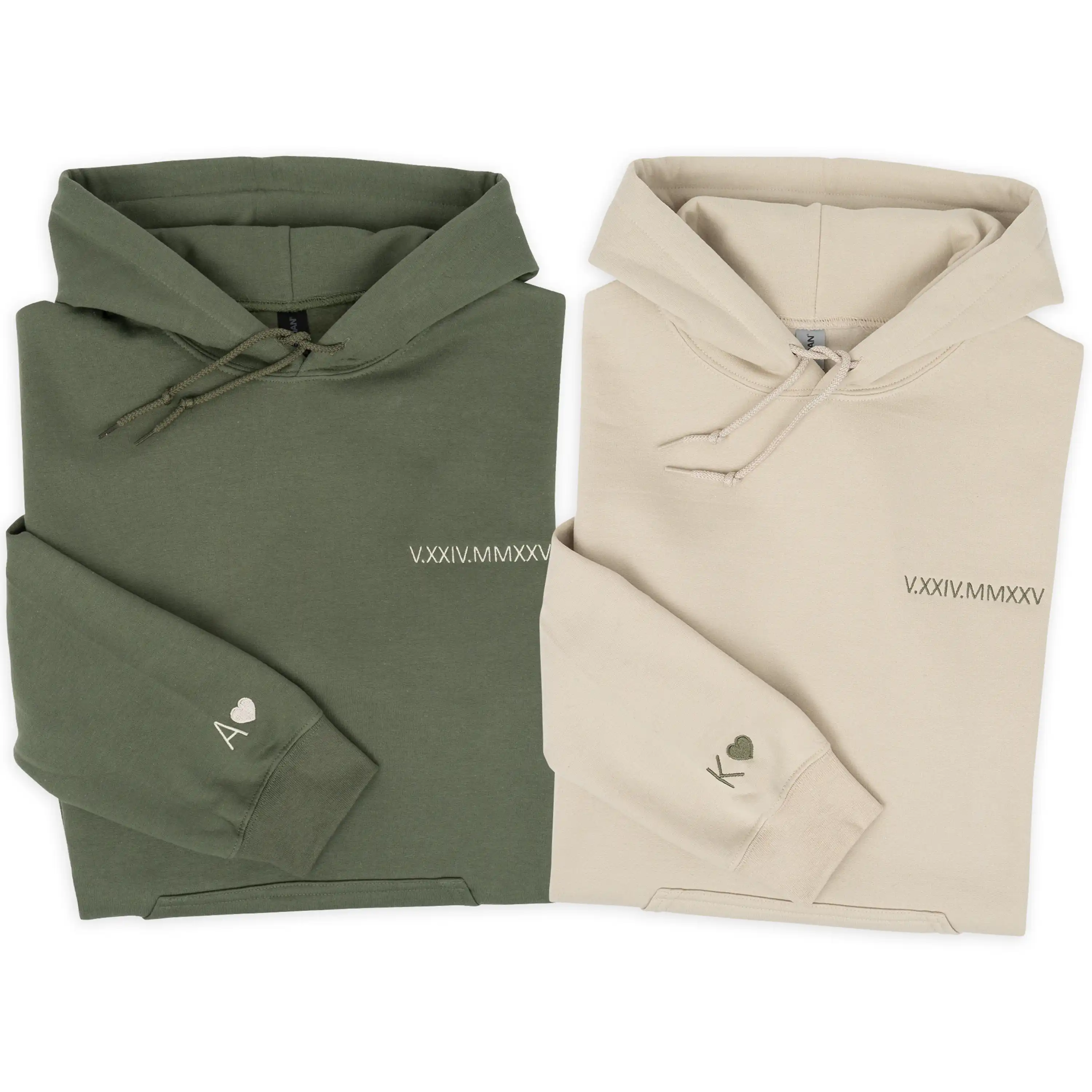 Two folded hoodies, one green and one beige, on a white background.