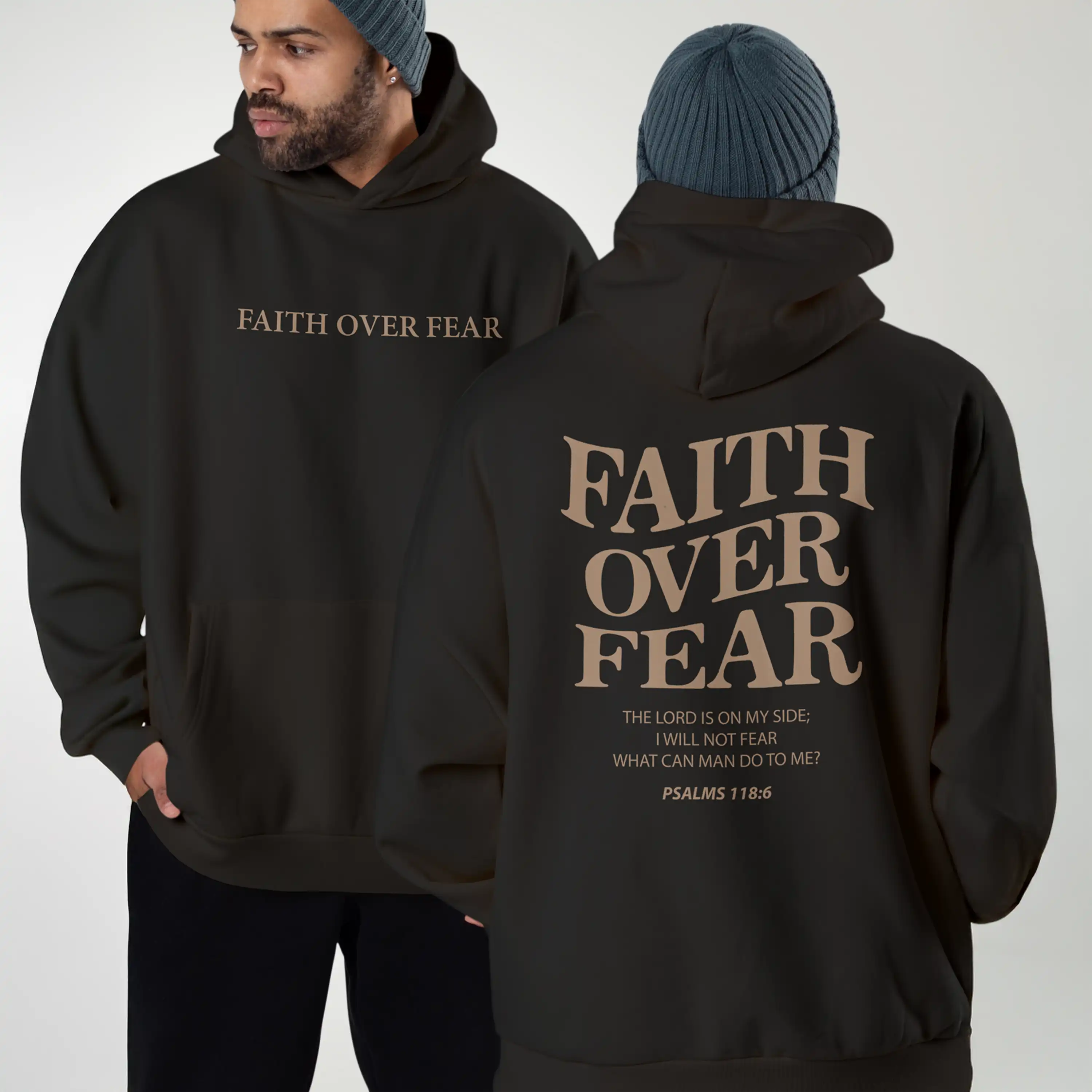 Black hoodie with 'Faith Over Fear' text on front and back, worn by a person.