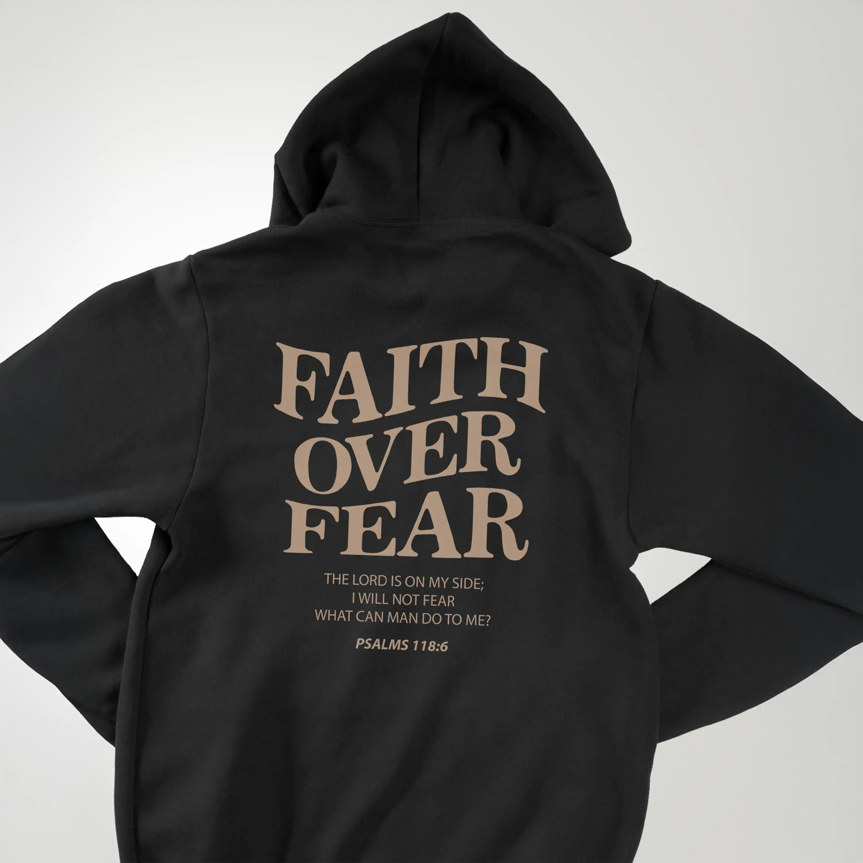 Black hoodie with 'Faith Over Fear' text on a white background